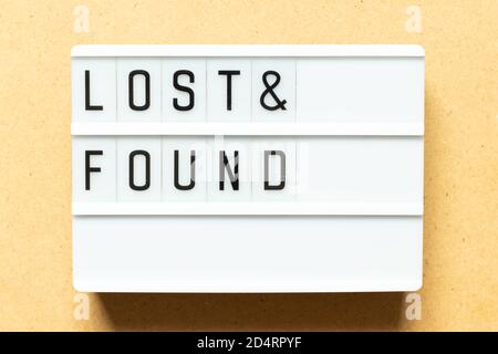 Lightbox with word lost & found on wood background Stock Photo