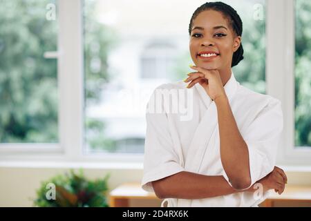 Attractive young woman in soft white towel Stock Photo