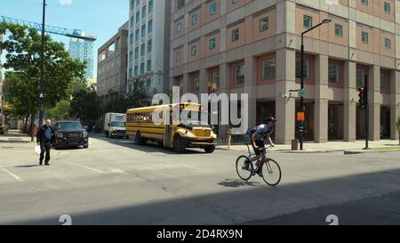 Montreal, Quebec, Canada - 25 June, 2018: School bus stopped at traffic light. Stock Photo