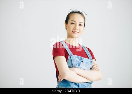 Pretty young woman in overall Stock Photo