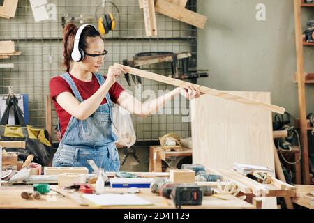 Checking plank evenness Stock Photo