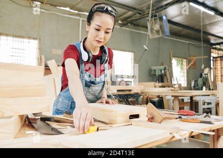Carpenter measuring crate Stock Photo