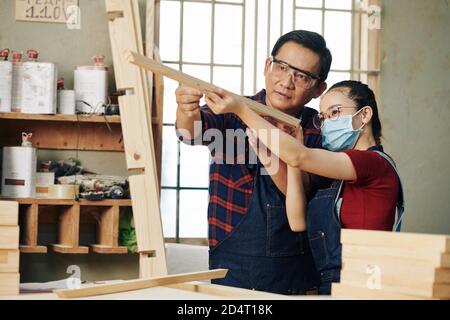 Checking plank evenness Stock Photo