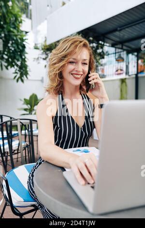Businesswoman talking on phone Stock Photo