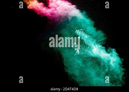 Abstract multi color powder explosion on black background. Stock Photo