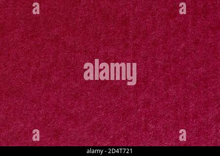 Red paper texture background, vertical stripes on macro. Stock Photo