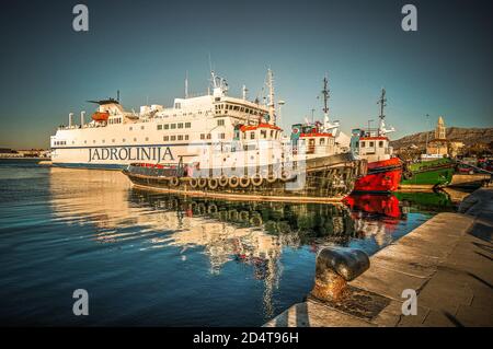 Tugboats and ferry boat in Split harbour, Croatia Stock Photo