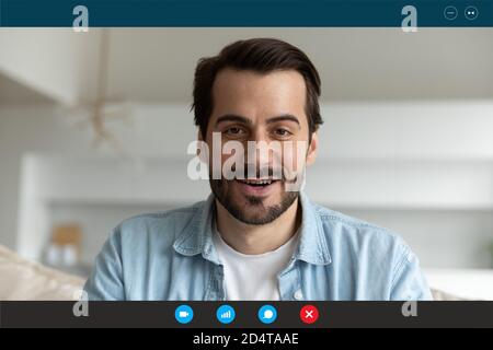 Young Caucasian man speak on video call Stock Photo