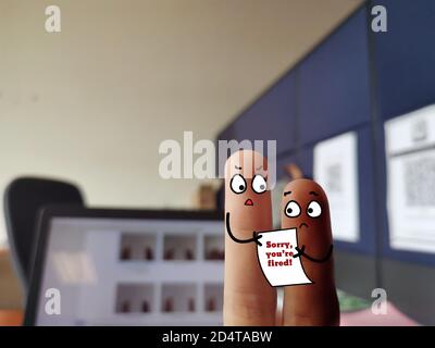 Two fingers are decorated as two person. They have different skin color. Stock Photo