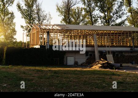 Frame house under construction on a sunset Stock Photo