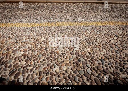 Closeup of an old road made with small cobblestones in Padua downtown, Veneto, Italy, southern Europe. Stock Photo