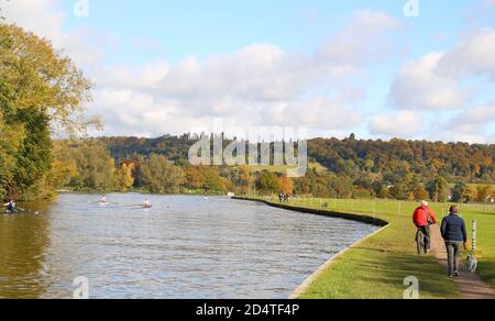 Henley-on-Thames, UK. 11th Oct, 2020. UK Weather. Walkers take advantage of one of the last warm summer days at the river Thames. Credit: Uwe Deffner/Alamy Live News Stock Photo
