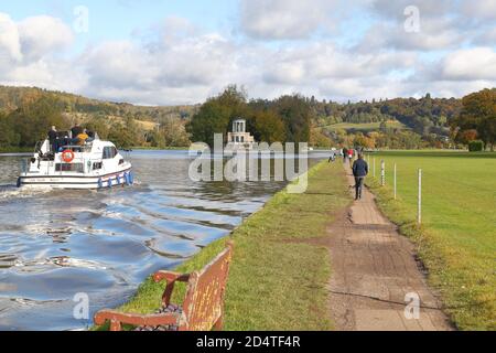 Henley-on-Thames, UK. 11th Oct, 2020. UK Weather. Walkers take advantage of one of the last warm summer days at the river Thames. Credit: Uwe Deffner/Alamy Live News Stock Photo