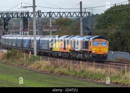 Electro-Motive Diesel Type JT42CWR Class 66 diesel locomotive at the front of double header freight trainn with Colas Rail Freight Class 60, 60047 at Stock Photo