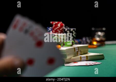 man playing poker holding cards Stock Photo
