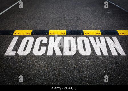 Lettering of the Word Lockdown on a Road Stock Photo