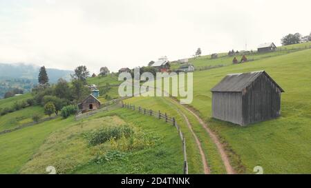 Rural wooden huts in mountains. Stock Photo