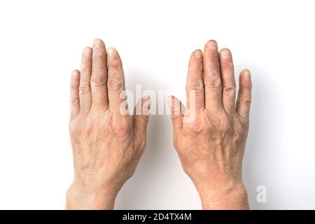 Working dirty hand of an elderly man close - up on a white background. Stock Photo