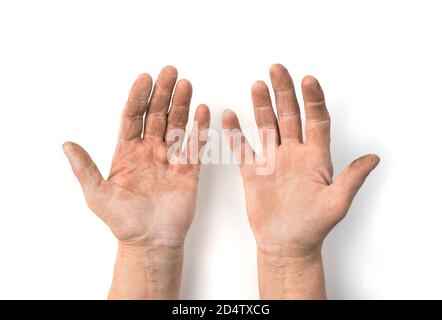 Adult hands smeared with work isolated on a white background. Stock Photo