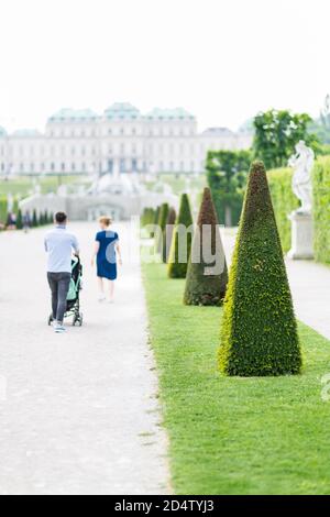 VIENNA - MAY 5: View along paths in the Belvedere Palace park of Vienna, Austria with blurred tourists in the background on May 5, 2018. Stock Photo