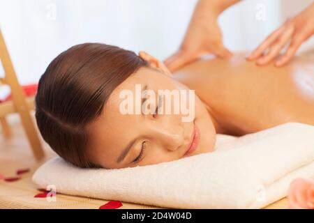 A person sitting on a bed Stock Photo