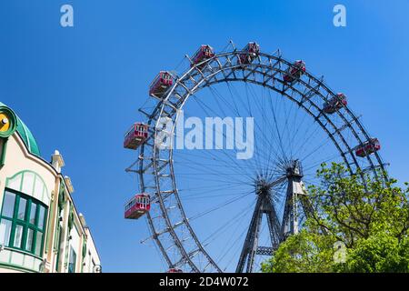 VIENNA - MAY 6: View of the famous ferris wheel Wiener Riesenrad in the Prater amusement park in Vienna, Austria on May 6, 2018 Stock Photo