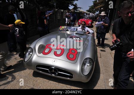 verona, italy, 13 may 2011, mille miglia, historic car rallye, finnish formule one driver mika häkkinen driving a mercedes benz 300 slr roadster Stock Photo