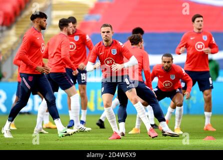 England's Jordan Henderson (centre) during the pre-match warm up prior to the beginning of the UEFA Nations League Group 2, League A match at Wembley Stadium, London. Stock Photo