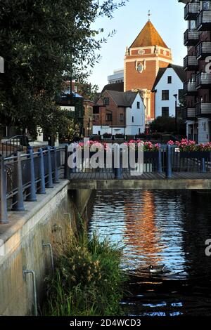 Kingston Upon Thames Guildhall and Charter Quay seen from the still River Thames, Surrey, England. Stock Photo