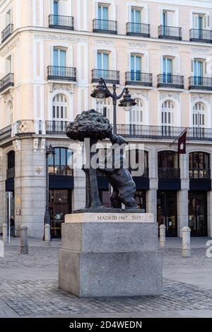 Madrid, Spain - 3rd October, 2020: Sculpture of the Bear and the Strawberry Tree in Puerta del Sol square, it is the main public space in the city. Vi Stock Photo
