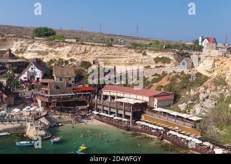 Mellieha, Malta - August 25, 2019: Coastal view of Popeye Village, also known as Sweethaven Village, purpose-built film set village that has been conv Stock Photo