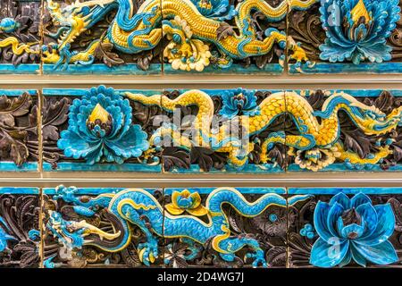 Lead-glazed stoneware dragon tiles from the roof of a  temple complex of the Ming dynasty in Shanxi Province, China. Stock Photo