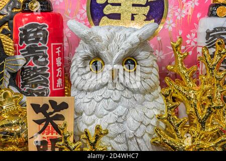 asakusa, japan - november 08 2019: Close up of auspicious rake decorated with lucky charms from Japanese folklore like Ural owl or golden corals for h Stock Photo