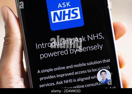 ASK NHS powered by Sensely, online and mobile Access to Local NHS Services, Virtual Assistant on mobile phone Stock Photo