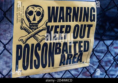 Warning, keep out, potion baited area sign. Stock Photo