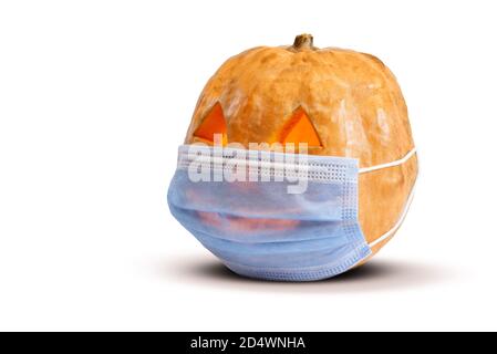 Jack o Lantern isolated on a white background with light inside and face mask. Stock Photo