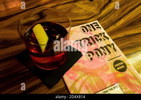 Freiburg, Germany. 09th Oct, 2020. A cocktail is on a flyer on the counter in the One Trick Pony Bar. The Freiburg bar operators won one of the coveted prizes in the category 'Strategy & Future' at the online Mixology Bar Awards. Credit: Philipp von Ditfurth/dpa/Alamy Live News Stock Photo