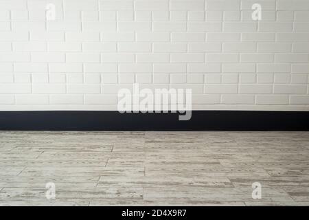 Brick wall and tile floor - interior of a corridor in the block of flats Stock Photo