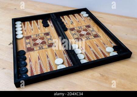 Backgammon set on wooden table Stock Photo