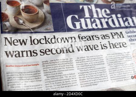 'New lockdown fears as PM warns second wave is here' covid 19 front page newspaper headline in The Guardian on 19 September 2020 London England UK Stock Photo