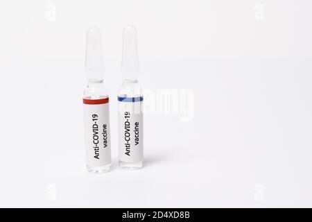 Two medicine ampule with anti covid-19 vaccine on white background Stock Photo