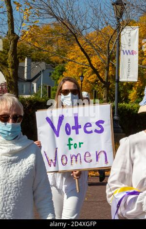 Grosse Pointe, Michigan, USA. 11th Oct, 2020. A parade marks the 100th anniversary of women winning the right to vote. The parade was organized by the American Association of University Women. Credit: Jim West/Alamy Live News Stock Photo