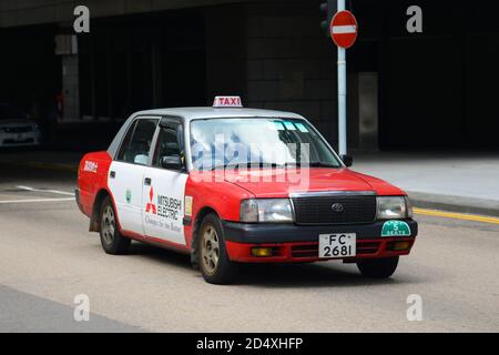 Hong Kong Urban red Toyota Crown Confort YXS10 four seats taxi in Hong Kong Island, Hong Kong, China. Stock Photo