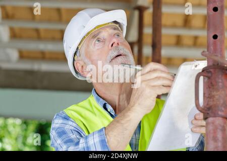 confident service man taking notes Stock Photo