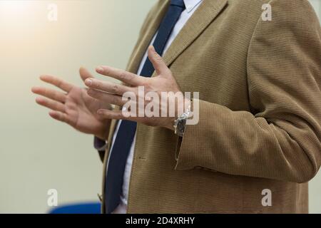 Selective focus on  teacher  while teaching and explaining lessons to students in classroom. Computer lab class, technology and aducation concept. Stock Photo