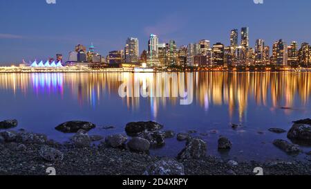 Night skyline with reflection of Vancouver Downtown as seen from Stanley Park, British Columbia, Canada