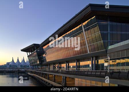 August 2020, Vancouver, British Columbia, Canada - Convention Center building with Canada Place in the background during sunrise, Vancouver Stock Photo