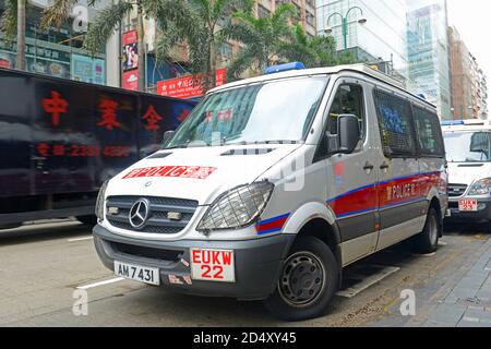 Hong Kong police vehicle on duty on Nathan Road in Kowloon, Hong Kong, China. The Mercedes-Benz Sprinter van is the most commonly seen police vehicles Stock Photo