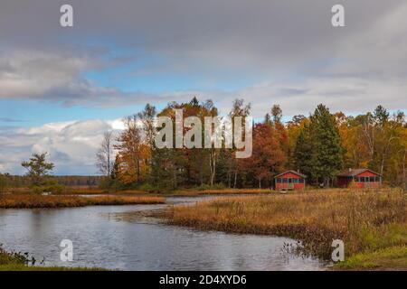 Two log cabins on Fishtrap Lake in northern Wisconsin. Stock Photo