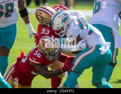 Santa Clara, CA, USA. 11th Oct, 2020. Miami Dolphins running back Myles Gaskin (37) is tackled by San Francisco 49ers outside linebacker Kwon Alexander (56) and San Francisco 49ers defensive tackle D.J. Jones (93) in the second quarter during a game at Levi's Stadium on Sunday, Oct. 11, 2020 in Santa Clara. Credit: Paul Kitagaki Jr./ZUMA Wire/Alamy Live News Stock Photo